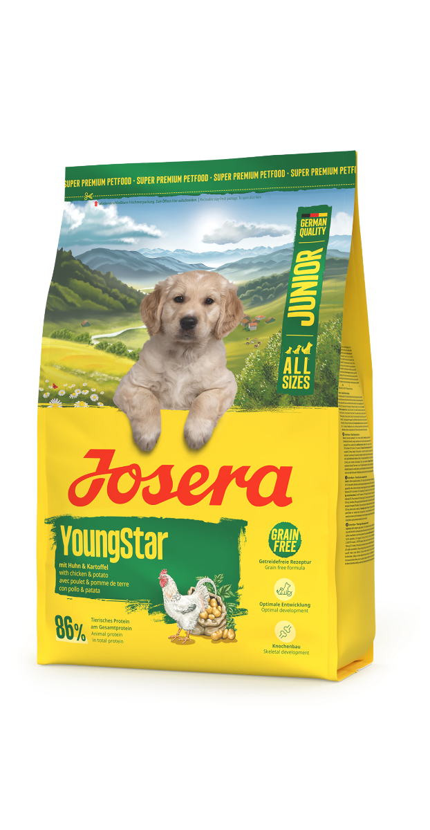 Josera YoungStar Hundefutter für Welpen mit Huhn & Kartoffel in gelber Verpackung mit Welpe und grüner Landschaft – getreidefrei und für alle Größen geeignet